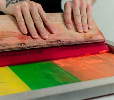 person holding brown wooden board