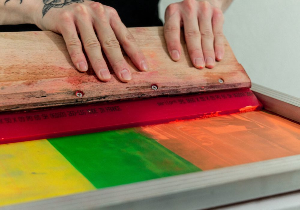 person holding brown wooden board